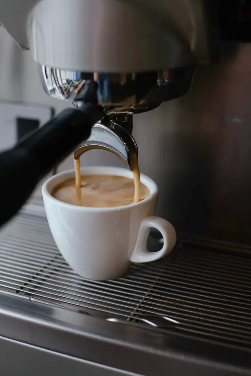 A white ceramic cup of black coffee
