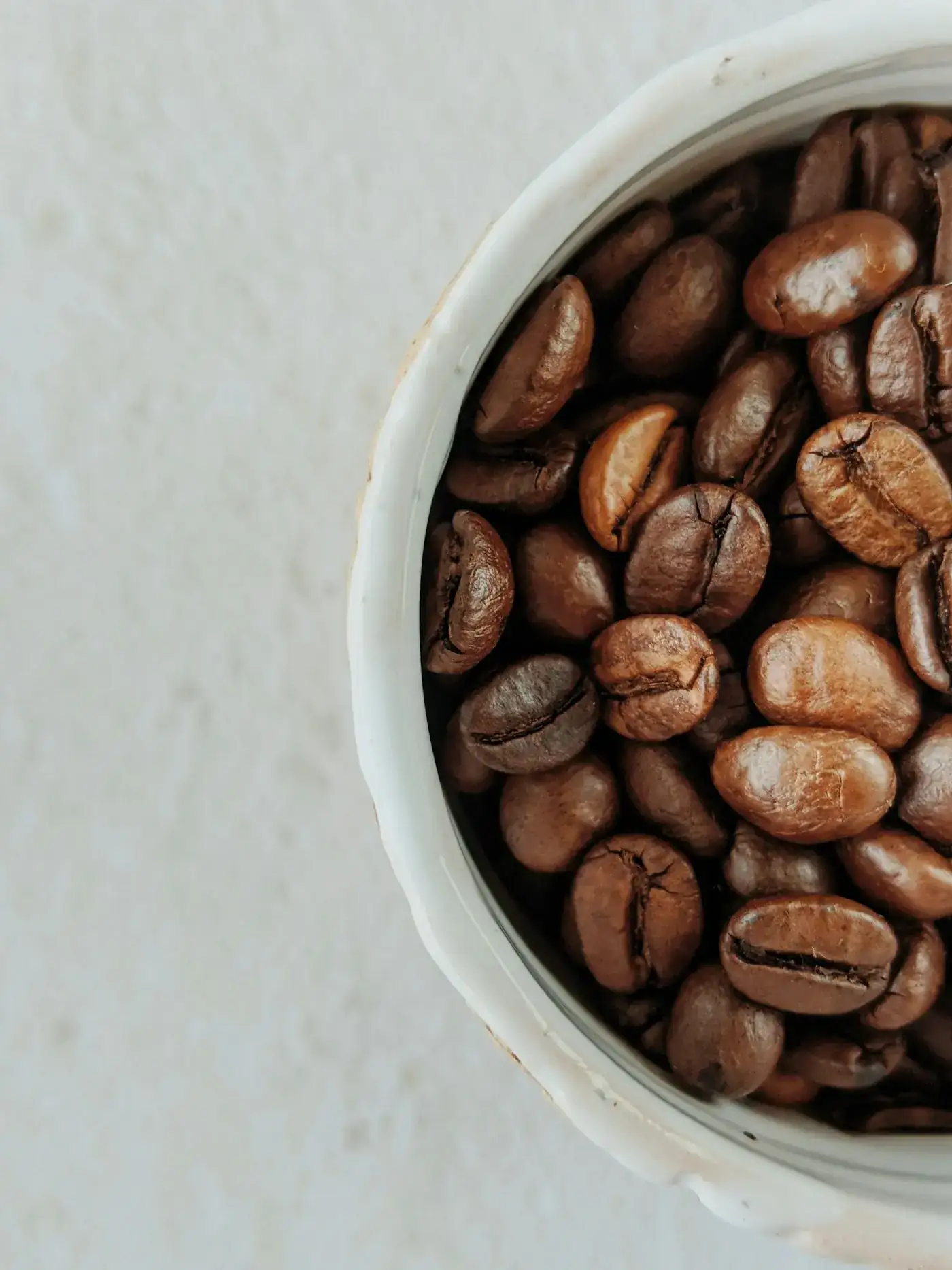 A bowl of roasted 100% Arabica beans
