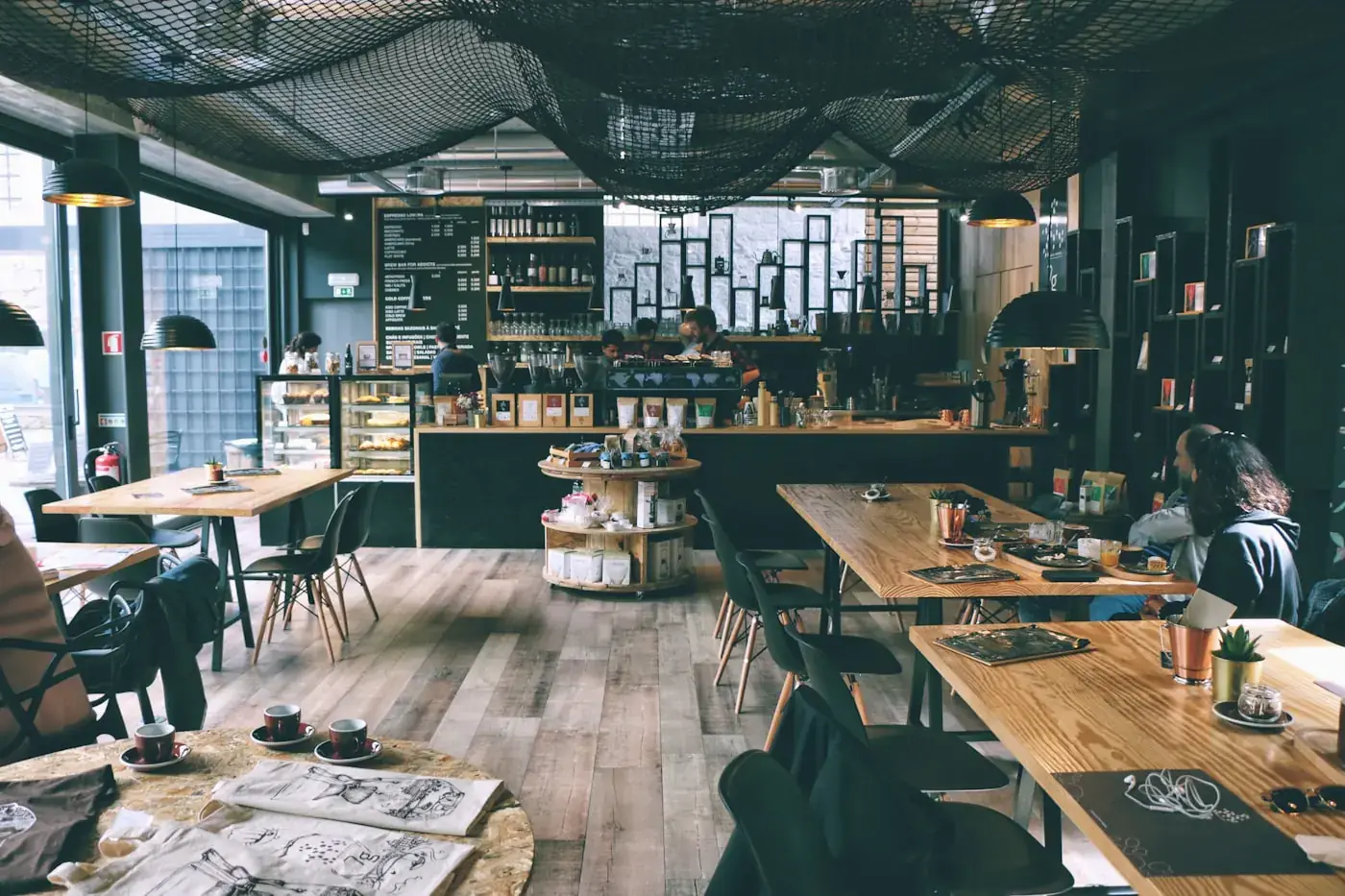 The Brew & Baker's bar, with an espresso machine and cups on the counter