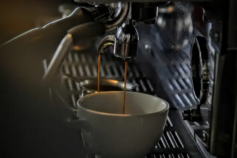 Espresso extracting from a portafilter into a cup